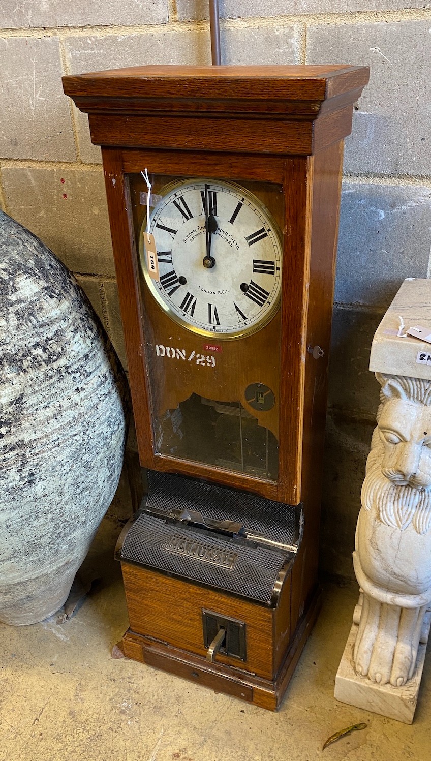 A late 19th / early 20th century National Time Recorder oak cased clocking in machine, height 109cm